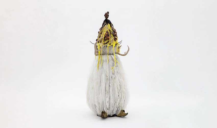 photo of life sized abstract sculpture resembling a figure